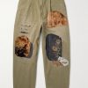 Katsuragi Tapered Appliquéd Distressed Cotton-Twill Trousers Katsuragi Tapered Appliquéd Distressed Cotton-Twill Trousers