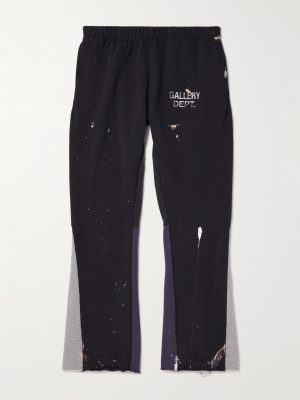 Flared Paint-Splattered Panelled Logo-Print Cotton-Jersey Sweatpants