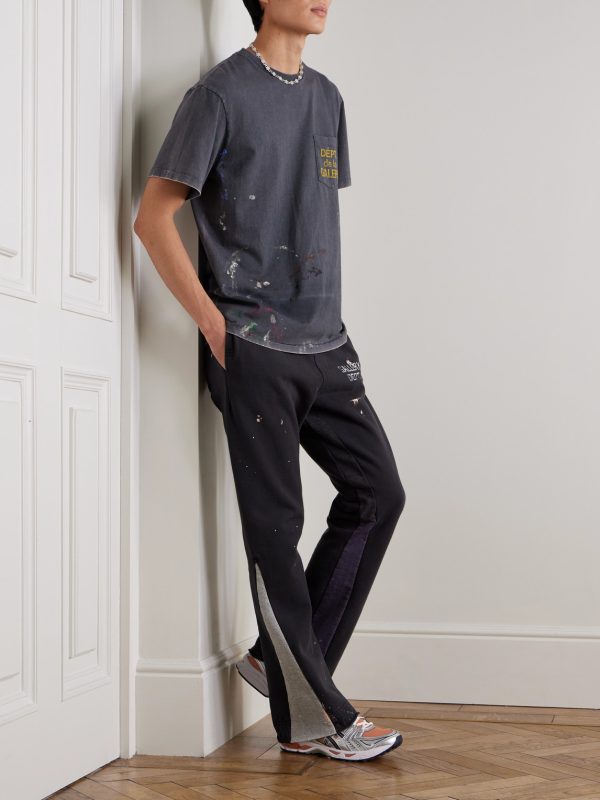 Flared Paint-Splattered Panelled Logo-Print Cotton-Jersey Sweatpants - OU Flared Paint-Splattered Panelled Logo-Print Cotton-Jersey Sweatpants - OU