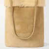 Triomphe Logo-Embossed Shearling Bucket Bag