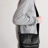Niki Small Logo-Appliquéd Textured-Leather Messenger Bag - OU Niki Small Logo-Appliquéd Textured-Leather Messenger Bag - OU