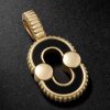 Magnetic 18-Karat Gold, Onyx and Mother-of-Pearl Pendant Magnetic 18-Karat Gold, Onyx and Mother-of-Pearl Pendant