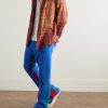 Flared Denim-Panelled Logo-Print Cotton-Jersey Sweatpants - OU Flared Denim-Panelled Logo-Print Cotton-Jersey Sweatpants - OU