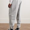 Solo Swoosh Tapered Logo-Embroidered Cotton-Blend Jersey Sweatpants - BK Solo Swoosh Tapered Logo-Embroidered Cotton-Blend Jersey Sweatpants - BK