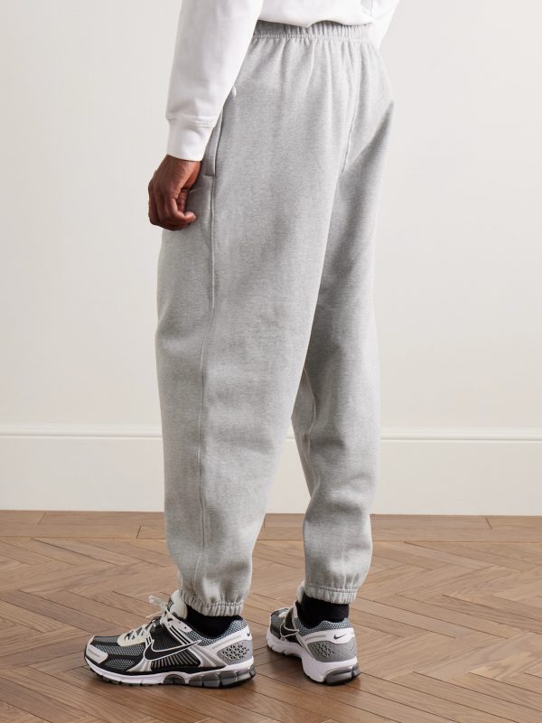 Solo Swoosh Tapered Logo-Embroidered Cotton-Blend Jersey Sweatpants - BK Solo Swoosh Tapered Logo-Embroidered Cotton-Blend Jersey Sweatpants - BK