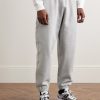 Solo Swoosh Tapered Logo-Embroidered Cotton-Blend Jersey Sweatpants - FR Solo Swoosh Tapered Logo-Embroidered Cotton-Blend Jersey Sweatpants - FR