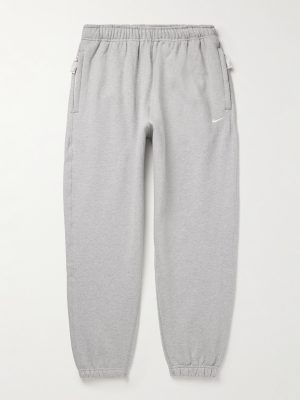Solo Swoosh Tapered Logo-Embroidered Cotton-Blend Jersey Sweatpants Solo Swoosh Tapered Logo-Embroidered Cotton-Blend Jersey Sweatpants