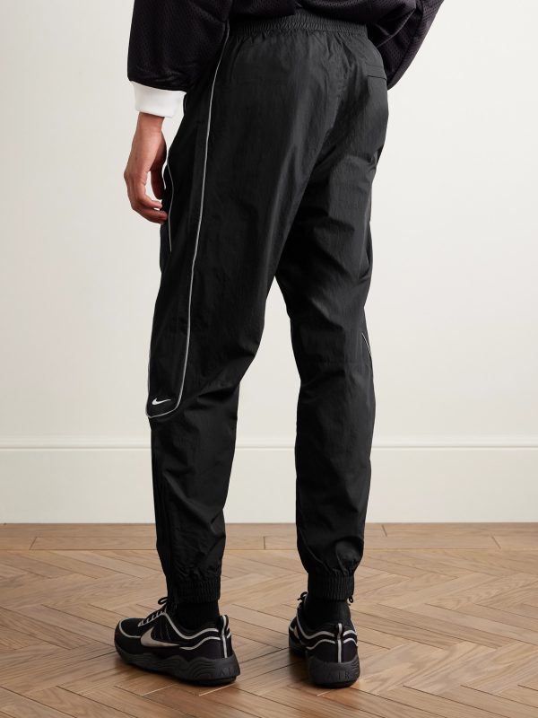 Solo Swoosh Logo-Embroidered Nylon Track Pants - BK Solo Swoosh Logo-Embroidered Nylon Track Pants - BK