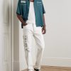 Slim-Fit Straight-Leg Logo-Print Paint-Splattered Jeans - OU Slim-Fit Straight-Leg Logo-Print Paint-Splattered Jeans - OU