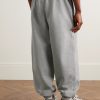 Solo Swoosh Tapered Logo-Embroidered Cotton-Blend Jersey Sweatpants - BK Solo Swoosh Tapered Logo-Embroidered Cotton-Blend Jersey Sweatpants - BK