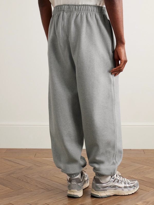 Solo Swoosh Tapered Logo-Embroidered Cotton-Blend Jersey Sweatpants - BK Solo Swoosh Tapered Logo-Embroidered Cotton-Blend Jersey Sweatpants - BK