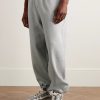 Solo Swoosh Tapered Logo-Embroidered Cotton-Blend Jersey Sweatpants - FR Solo Swoosh Tapered Logo-Embroidered Cotton-Blend Jersey Sweatpants - FR