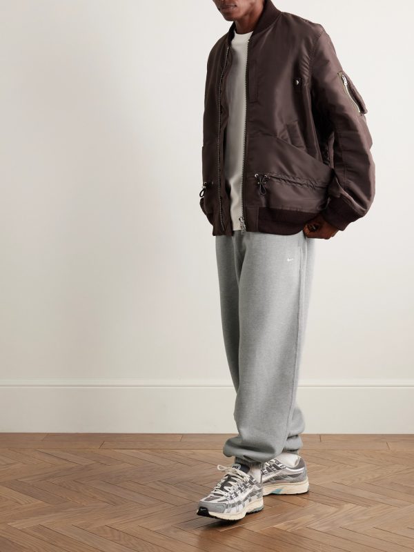 Solo Swoosh Tapered Logo-Embroidered Cotton-Blend Jersey Sweatpants - OU Solo Swoosh Tapered Logo-Embroidered Cotton-Blend Jersey Sweatpants - OU