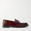 Le Loafer Monogram Logo-Appliquéd Eel Penny Loafers Le Loafer Monogram Logo-Appliquéd Eel Penny Loafers