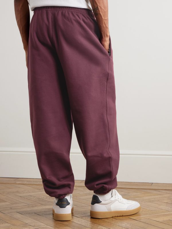 Solo Swoosh Tapered Logo-Embroidered Cotton-Blend Jersey Sweatpants - BK Solo Swoosh Tapered Logo-Embroidered Cotton-Blend Jersey Sweatpants - BK