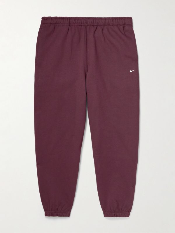 Solo Swoosh Tapered Logo-Embroidered Cotton-Blend Jersey Sweatpants Solo Swoosh Tapered Logo-Embroidered Cotton-Blend Jersey Sweatpants