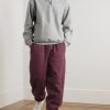 Solo Swoosh Tapered Logo-Embroidered Cotton-Blend Jersey Sweatpants - OU Solo Swoosh Tapered Logo-Embroidered Cotton-Blend Jersey Sweatpants - OU