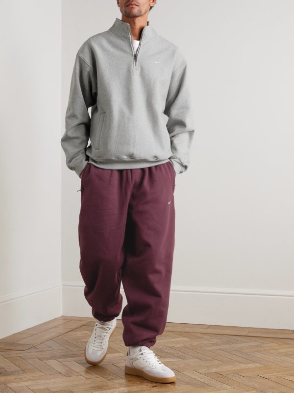 Solo Swoosh Tapered Logo-Embroidered Cotton-Blend Jersey Sweatpants - OU Solo Swoosh Tapered Logo-Embroidered Cotton-Blend Jersey Sweatpants - OU