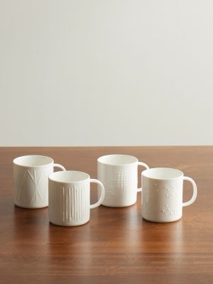 Set of Four Embossed Porcelain Mugs Set of Four Embossed Porcelain Mugs