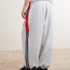 + Willy Chavarria Tapered Appliquéd Stretch-Cotton Jersey Sweatpants - BK