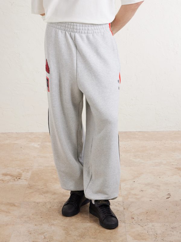 + Willy Chavarria Tapered Appliquéd Stretch-Cotton Jersey Sweatpants - FR