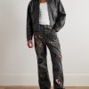 G-Time Flared Distressed Logo-Appliquéd Jeans - OU