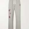 Youth Enrichment Wide-Leg Logo-Print Distressed Cotton Sweatpants Youth Enrichment Wide-Leg Logo-Print Distressed Cotton Sweatpants