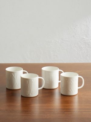 Set of Four Embossed Ceramic Mugs Set of Four Embossed Ceramic Mugs