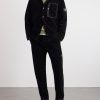 Straight-Leg Logo-Appliquéd Garment-Dyed Cotton-Corduroy Trousers - OU Straight-Leg Logo-Appliquéd Garment-Dyed Cotton-Corduroy Trousers - OU