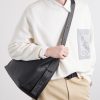 Loop Logo-Debossed Leather Messenger Bag - OU Loop Logo-Debossed Leather Messenger Bag - OU