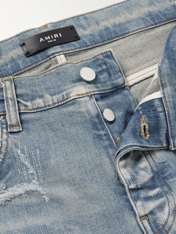 Skinny-Fit Logo-Embroidered Distressed Patchwork Jeans - E1 Skinny-Fit Logo-Embroidered Distressed Patchwork Jeans - E1