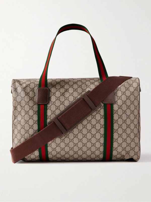 Leather- and Webbing-Trimmed Monogrammed Supreme Coated-Canvas Holdall Leather- and Webbing-Trimmed Monogrammed Supreme Coated-Canvas Holdall